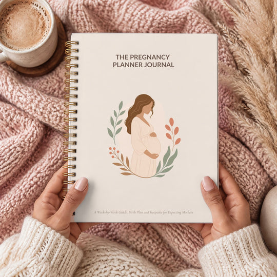 The Pregnancy Planner, held in hands